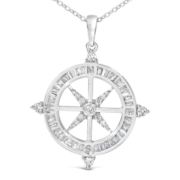 Angled view of the diamond compass pendant showing the prong-set round diamonds at the points