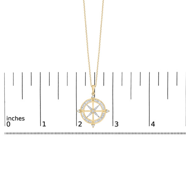 Compass medallion pendant on the 18 inch cable chain shown against a scale reference for size