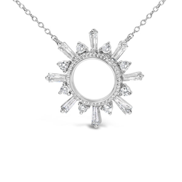 Close view of the starburst medallion showing prong-set baguette and round diamonds