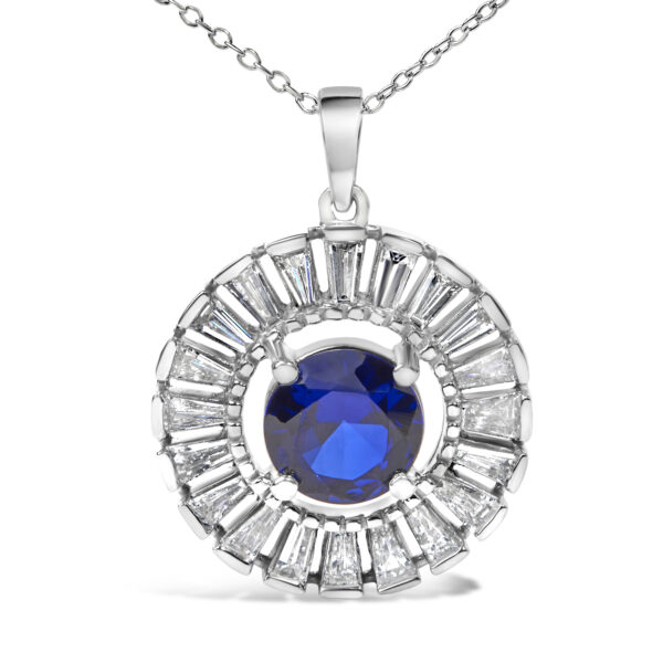 Close angle of the pendant showing the channel-set baguette diamonds around the blue center stone