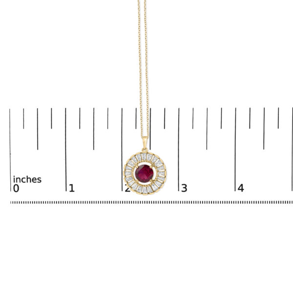 Medallion pendant shown next to a scale reference to indicate its size