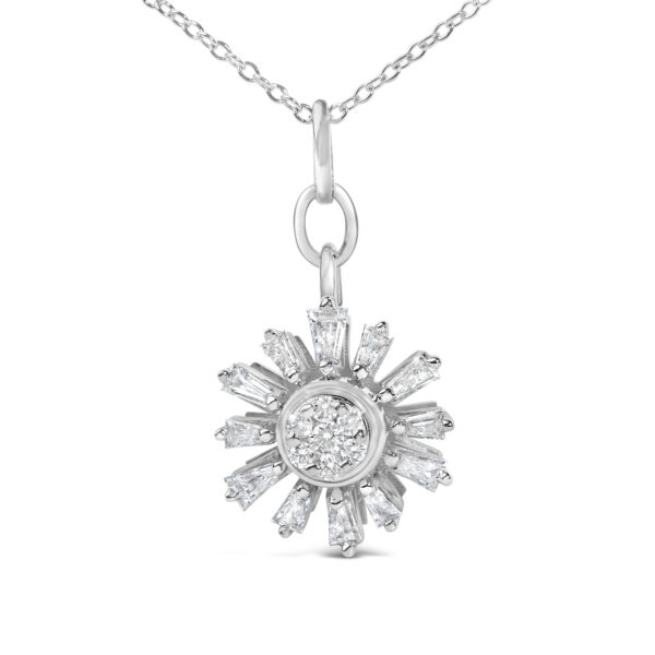 Close-up of starburst pendant showing prong-set baguette diamonds radiating from a round diamond center