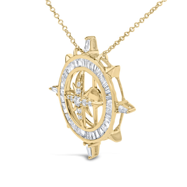 Close-up of the compass pendant highlighting the channel-set baguette diamonds