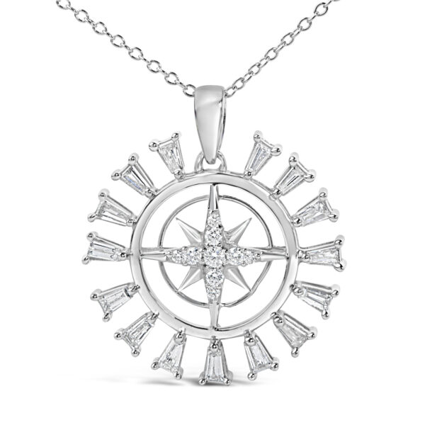 Close view of the pendant showing prong-set baguette diamonds around an inner compass star design