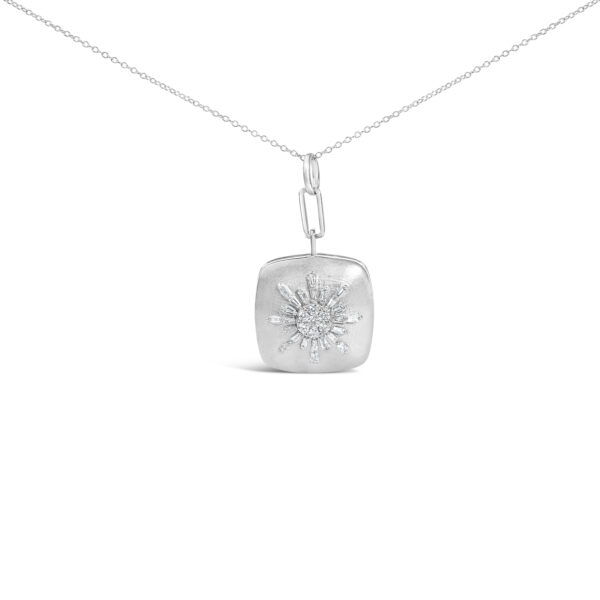Sunburst medallion pendant with baguette and round diamonds on an 18 inch cable chain, laid flat