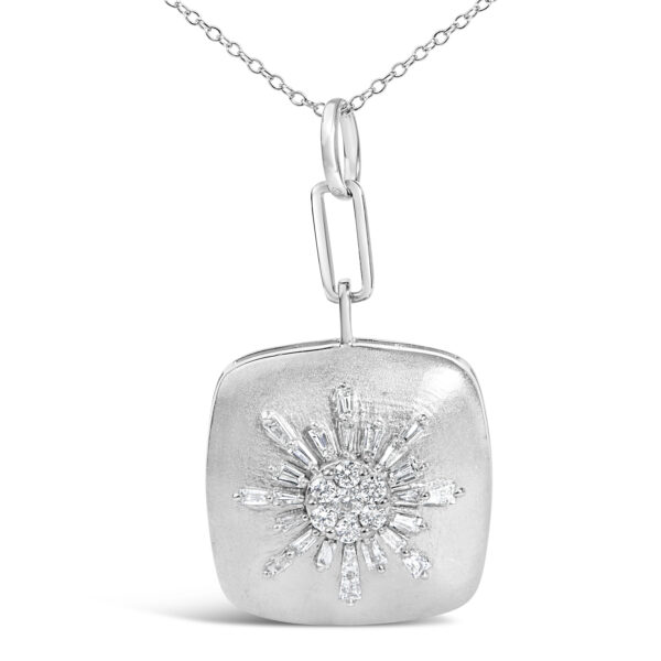 Close-up of the sunburst pendant showing the prong-set diamonds and rhodium plated silver finish