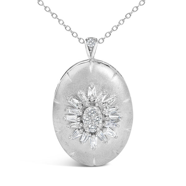 Close view of the oval medallion showing baguette and round diamonds set at its center
