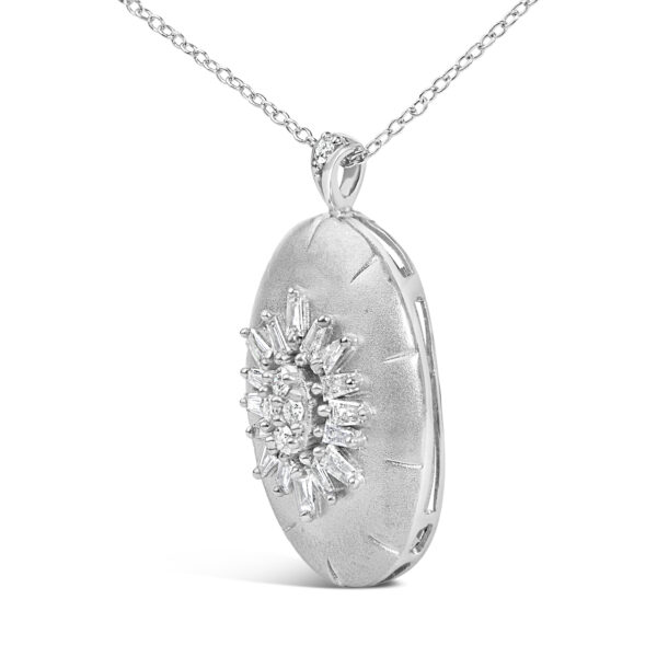 Side angle of the puffed oval medallion pendant showing its rounded profile