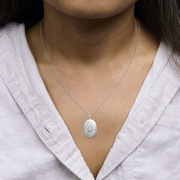 Pendant necklace shown worn at the neckline