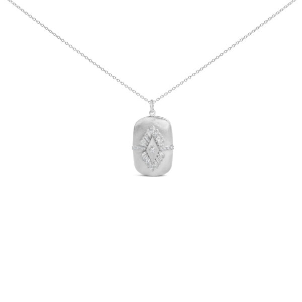 Puffed medallion pendant with baguette and round diamonds on a sterling silver cable chain