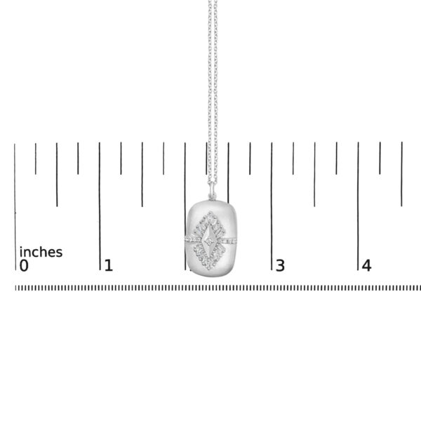 Medallion pendant necklace laid flat with a ruler showing the 18 inch chain length