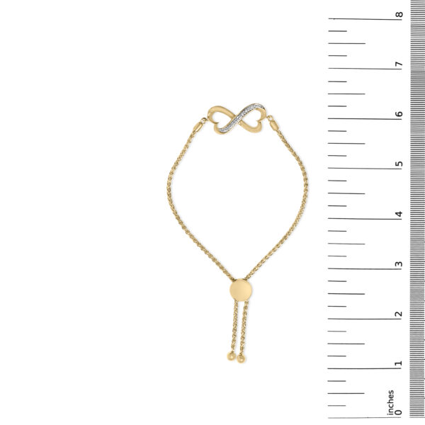 24K gold plated sterling silver heart infinity bolo bracelet laid flat to show its scale