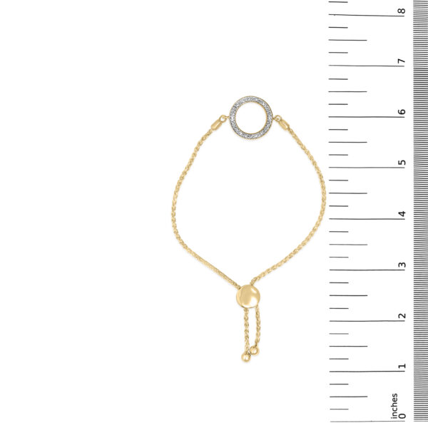 24K gold plated bolo bracelet shown next to a ruler for scale reference