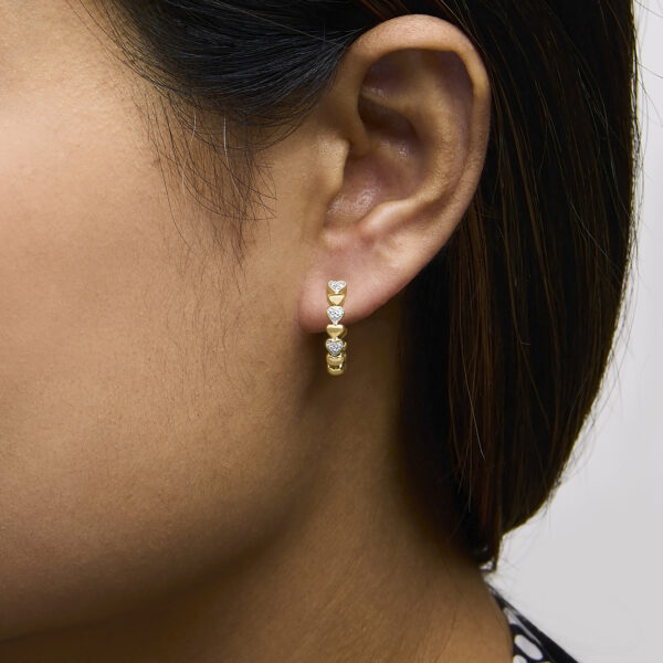 24K gold vermeil heart hoop earring shown worn on an ear