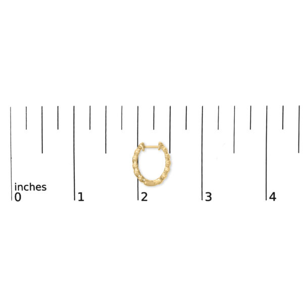 24K gold vermeil heart hoop earring shown next to a scale reference for size