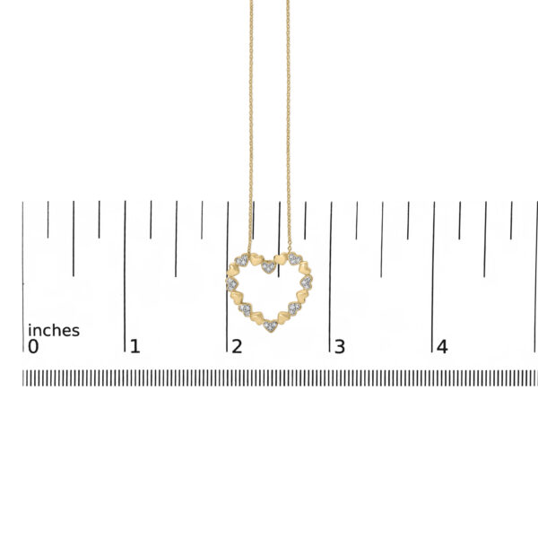 Puffed heart pendant necklace shown at scale to indicate its dimensions