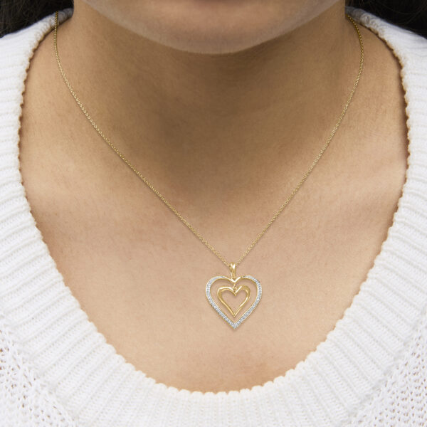 24K gold vermeil double heart pendant necklace worn at the collarbone