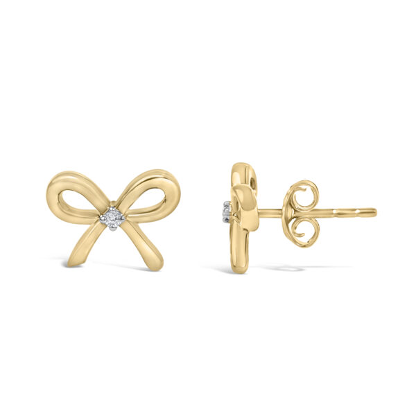 Close-up of the prong-set round diamond at the center of the bow earring