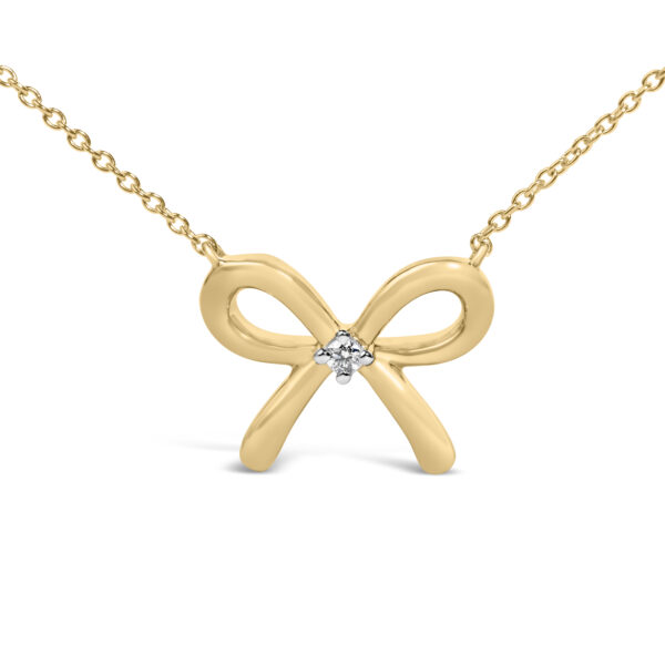 Bow tie pendant necklace shown from a slightly angled view, highlighting the cable chain link