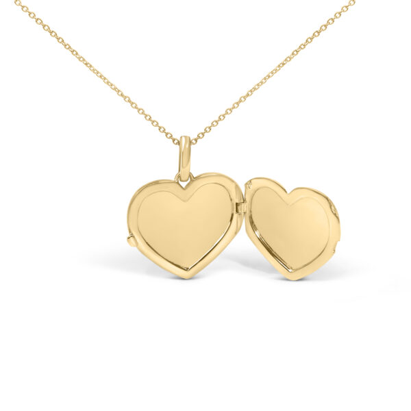 Side view of the heart locket pendant showing its edge and chain attachment