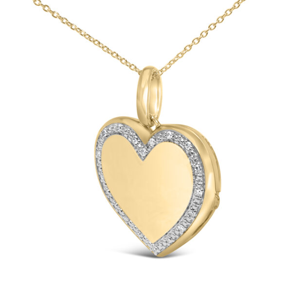Open heart locket pendant showing the two compartments inside