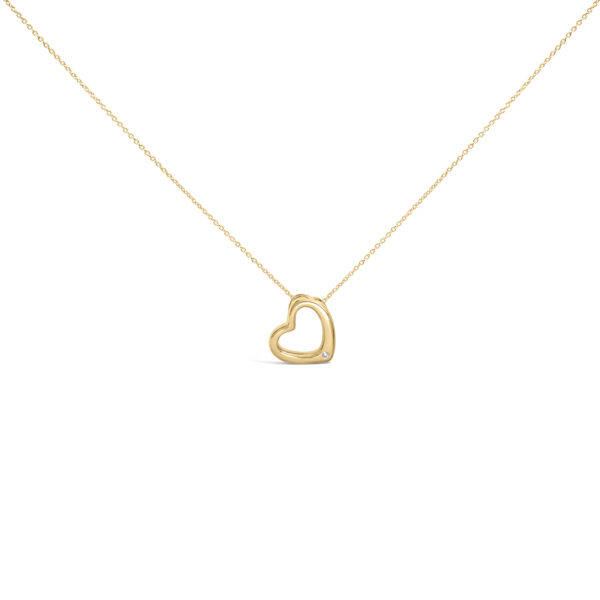 Heart-shaped pendant in 24K gold vermeil with a small bezel-set diamond, shown on a cable chain