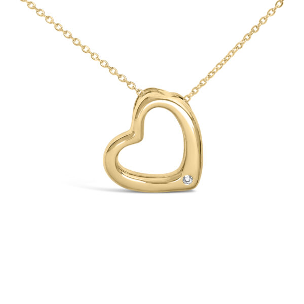 Heart pendant necklace shown from a side angle on its cable chain