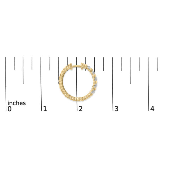 Ribbed diamond hoop earrings shown at scale for size reference