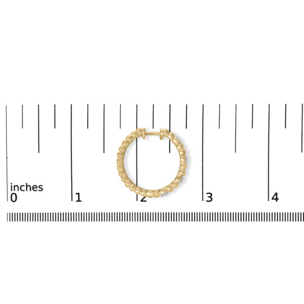 Pair of ribbed hoop earrings shown together with a scale reference for size