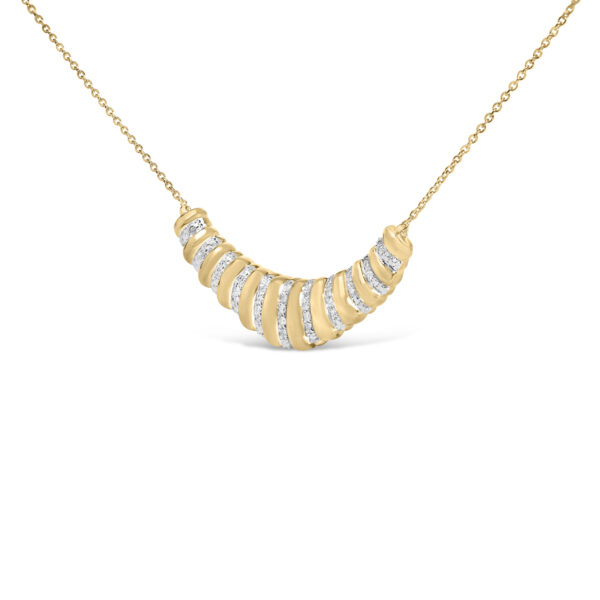 Close-up of the pave-set round diamonds along the ribbed surface of the pendant