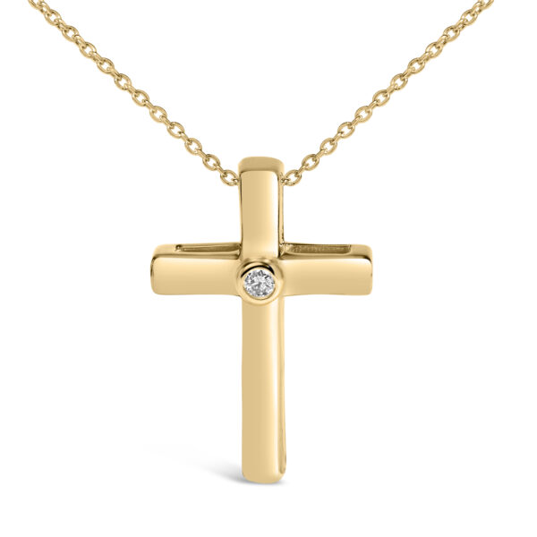 Close-up of the cross pendant showing the bezel setting around the round diamond
