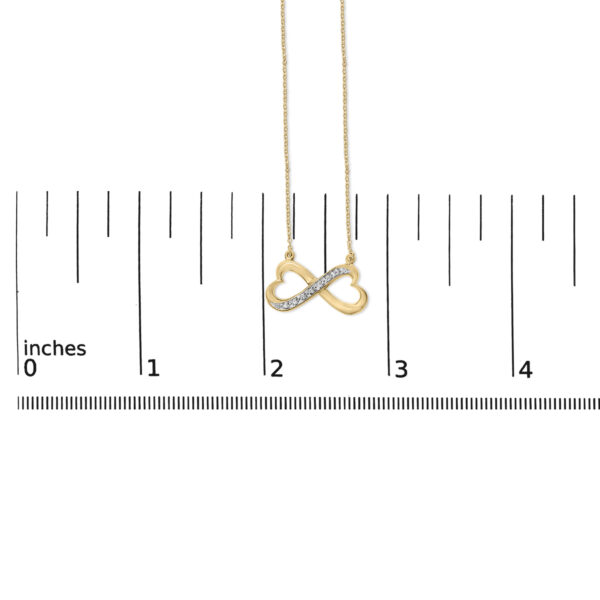 Infinity heart pendant necklace shown with a scale reference for size