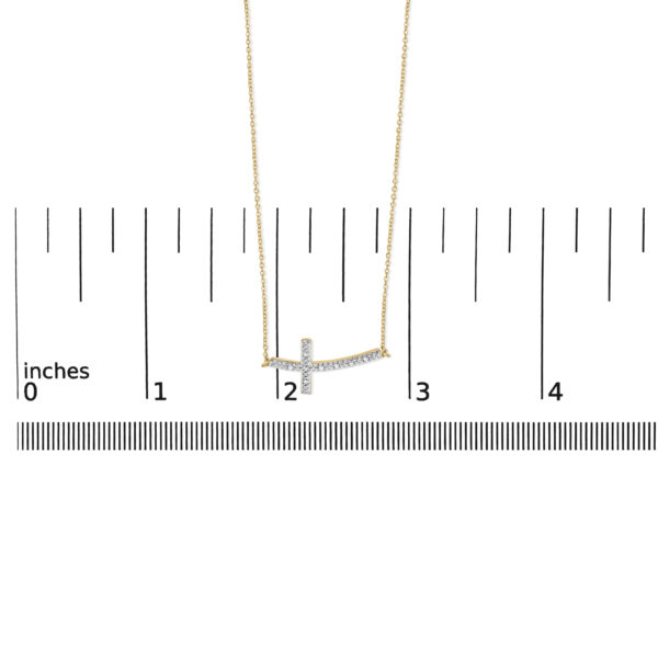 Cross bar necklace shown next to a scale reference to indicate its size