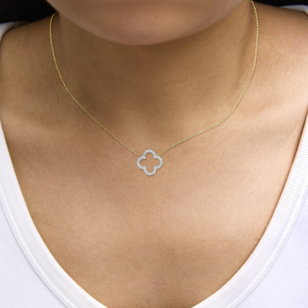 24K gold vermeil diamond clover pendant necklace worn at the neckline on a model
