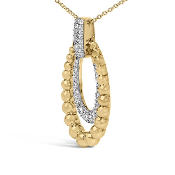 Close-up of pave-set round diamonds in gold vermeil bead pendant
