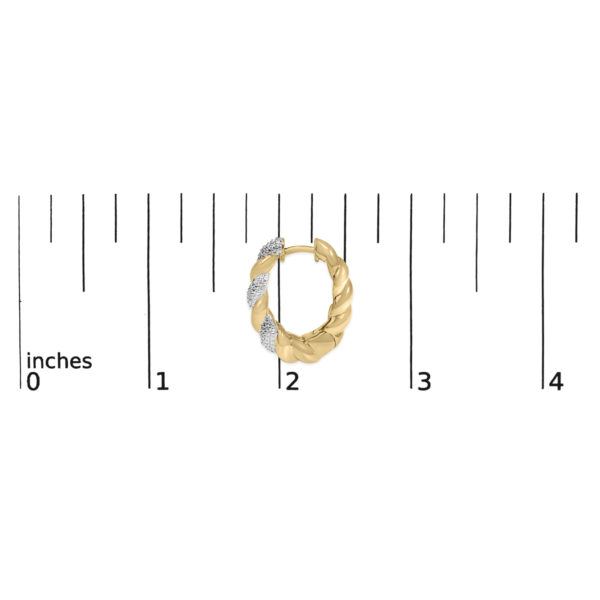 Gold rope hoop earring shown next to a ruler for scale reference