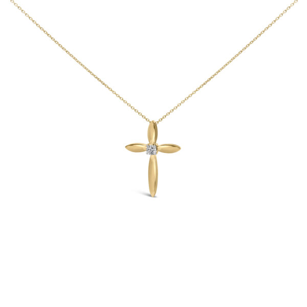 Cross pendant in gold-toned vermeil with a single diamond at its center, hanging from a cable chain
