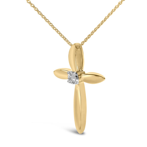 Close-up of the round diamond set at the center of the cross pendant in a prong setting