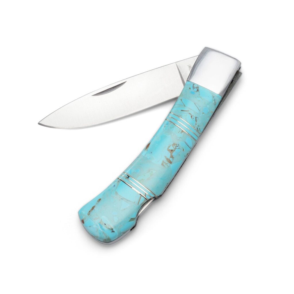 Folded stainless steel pocket knife with a patterned stone-inlay handle, blade closed