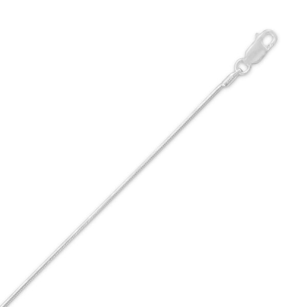 Thin silver-toned snake chain necklace coiled to show its smooth, continuous link pattern