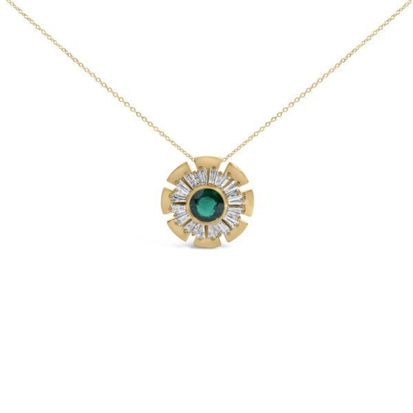 Medallion pendant necklace with a round green center stone and baguette diamonds set in a gold-toned metal disk