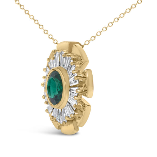 Close-up of the baguette diamonds and center emerald on the medallion pendant