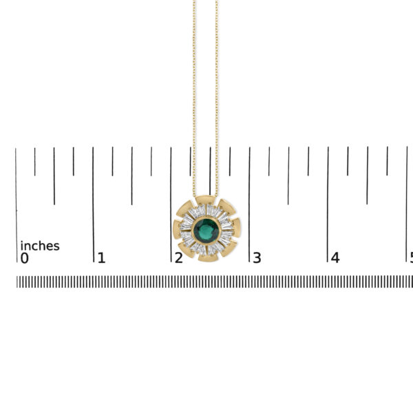 Medallion pendant beside a scale reference showing its size