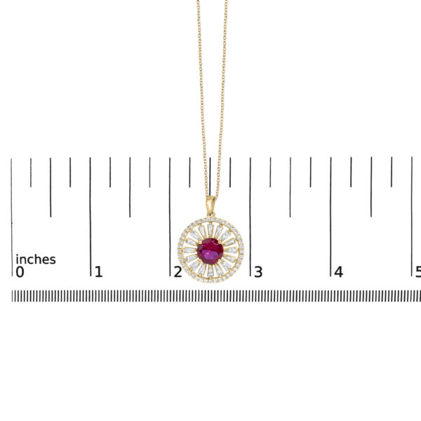 Sunburst medallion pendant next to a scale reference showing its dimensions