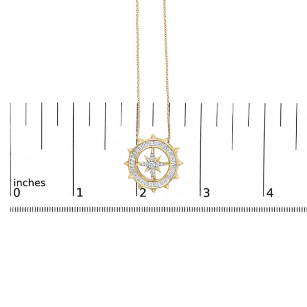 Compass medallion pendant necklace shown next to a scale reference for size