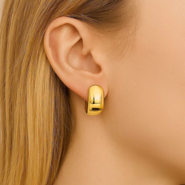 Wide Huggie Hoop Earrings in 14K Yellow Gold - alternate view 3