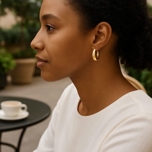 Medium Tapered Hoop Earrings in 14K Yellow Gold - alternate view 4