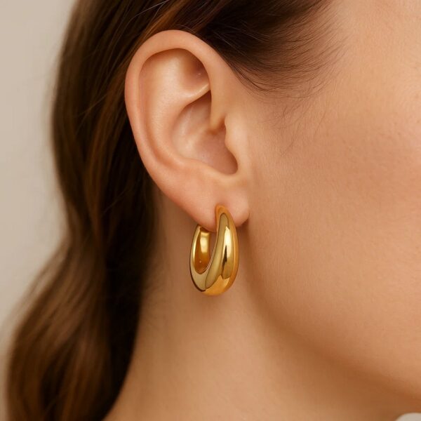 Medium Tapered Hoop Earrings in 14K Yellow Gold - alternate view 5